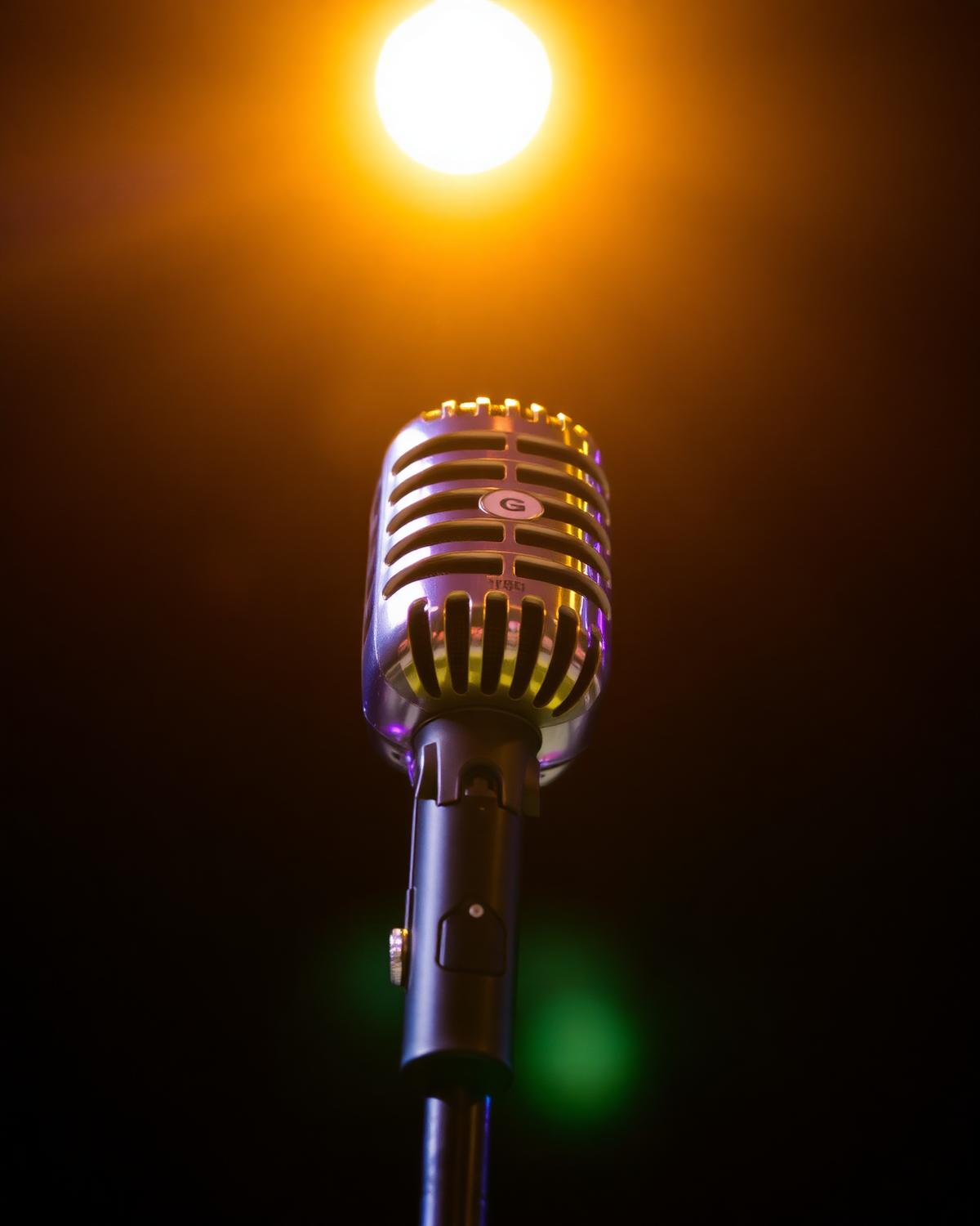 Chrome microphone under a spotlight for karaoke
